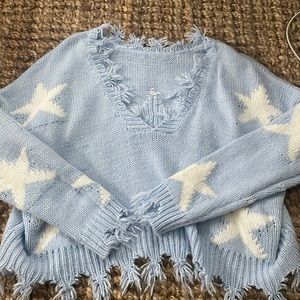 blue distressed star sweater